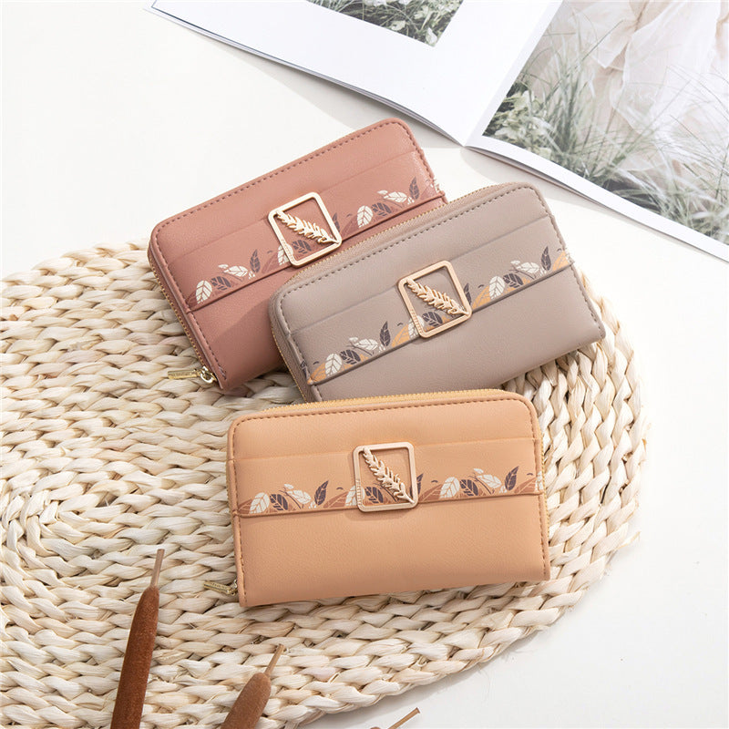 Cartera de cuero con clip para dinero con estampado de botones a presión para mujer