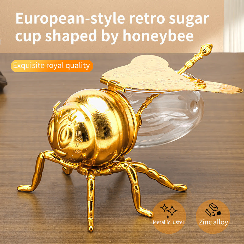 Tarro de miel con forma de abeja y cuchara, versátil y novedoso, ideal para condimentos, aceite, fiestas y utensilios de cocina.